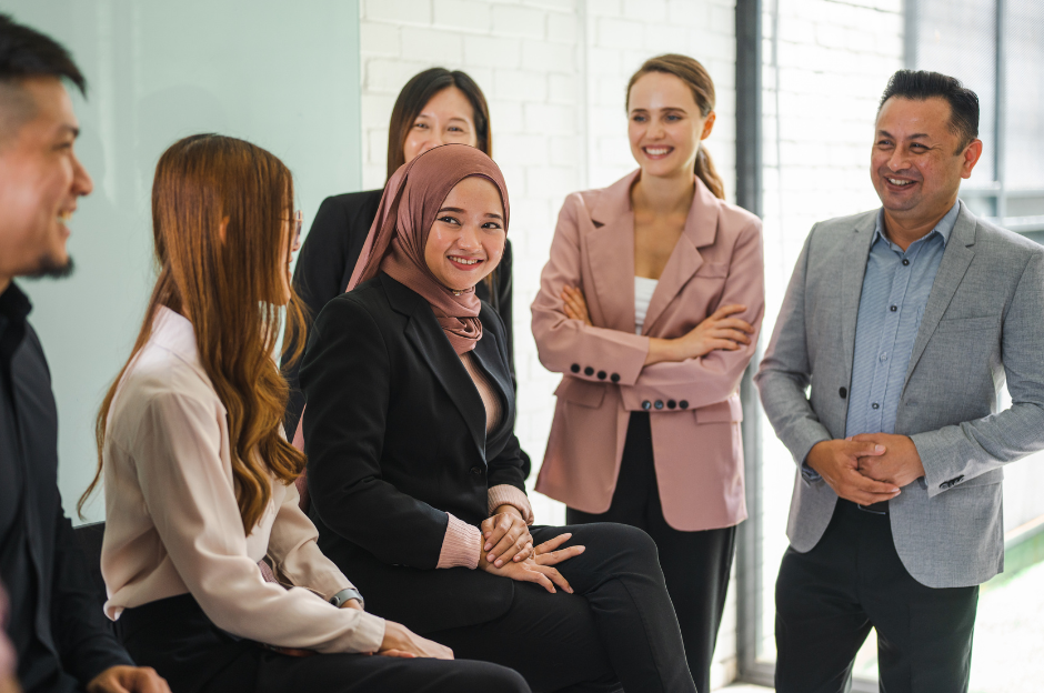 Hireloft Office team talking and laughing.