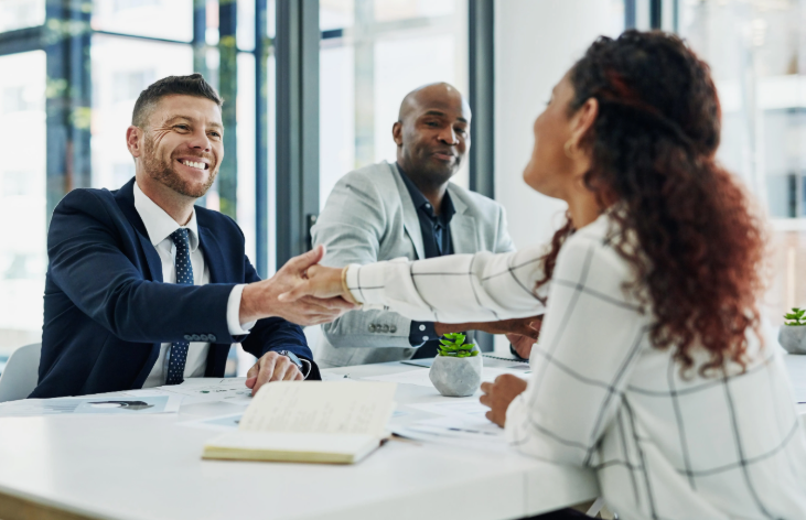 Woman shaking hands with hireloft Recruitment Agency interviewer